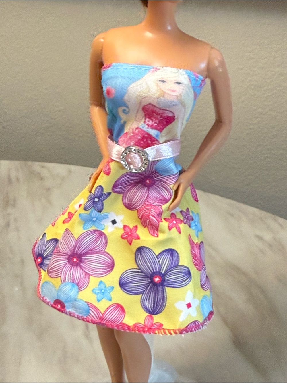 Barbie multi color strapless dress with white belt